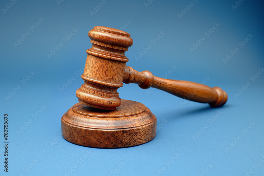 Wooden gavel on a light blue background. Wooden gavel on a light blue background.