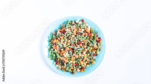 A mixture of frozen vegetables prepared for food. The concept of cooking quick-frozen foods.