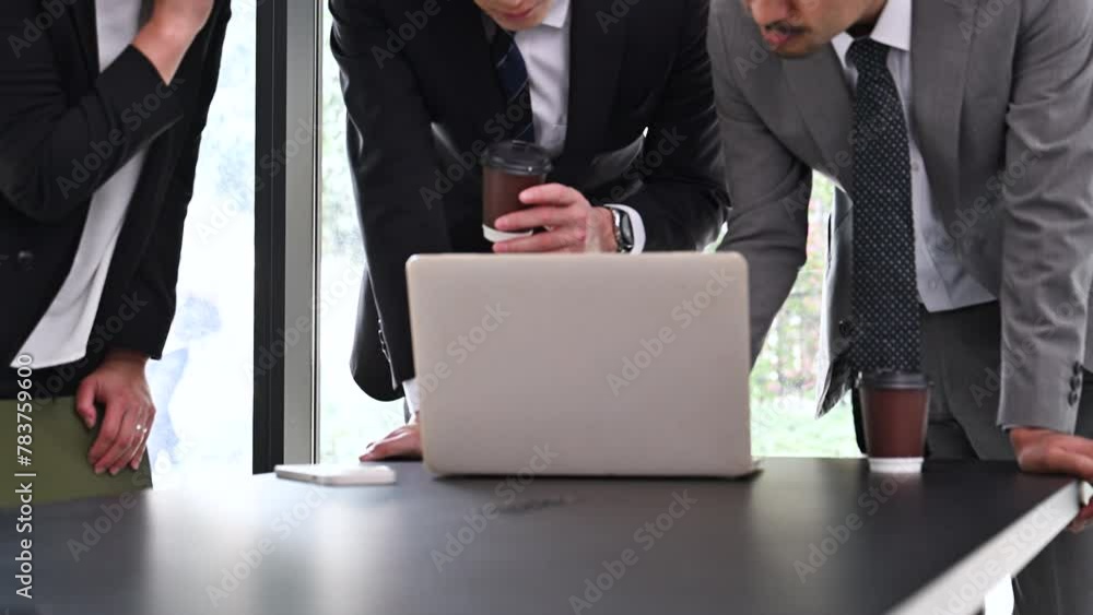 Multiple businessmen in a meeting while looking at a computer Video of communication by expressing opinions Close-up of the hand Multiple businessmen in a meeting while looking at a computer Video of communication by expressing opinions Close-up of the hand
