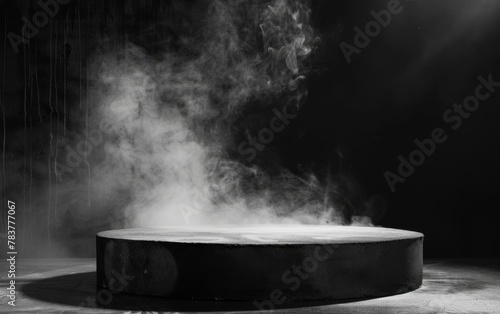 Gray textured concrete platform podium or table with smoke in the dark