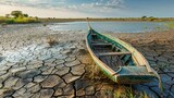 A serene lake that has dried up, a boat stranded in the cracked mud, showcasing the effects of prolonged droughts