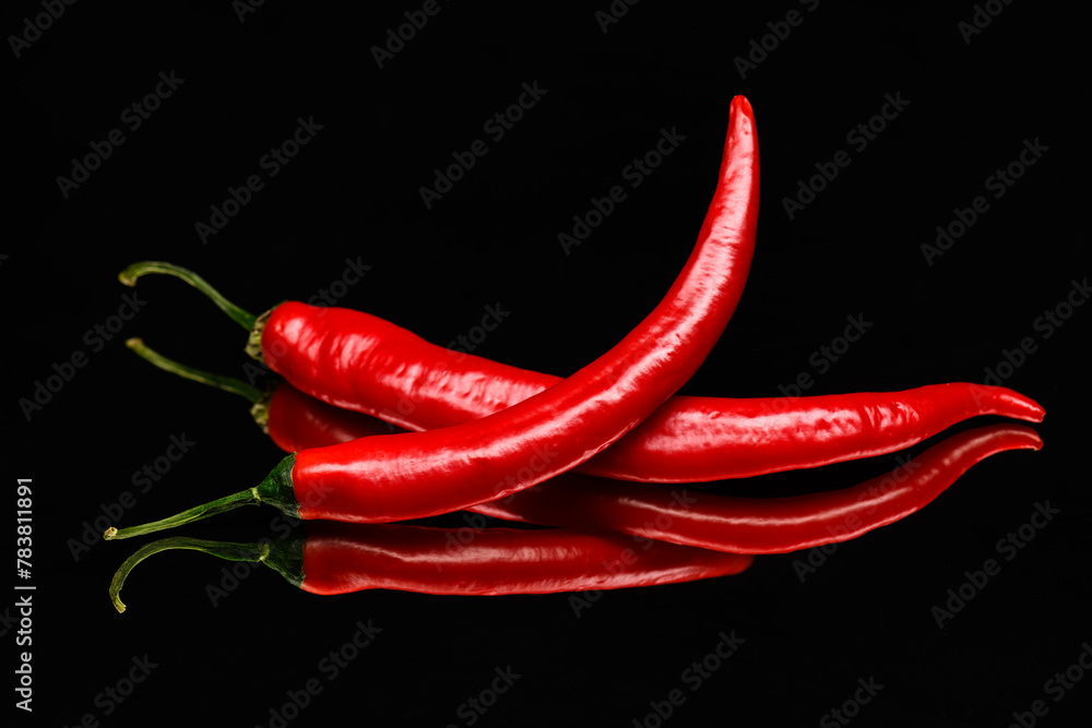 red chili peppers on a black background red chili peppers on a black background