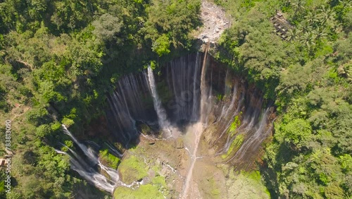 aerial view waterfall coban sewu in Java, indonesia. waterfall in tropical forest by drone Tumpak Sewu aerial footage photo