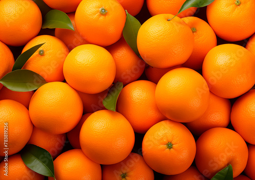 Mandarins with leaves background, top view, heap of citrus fruits