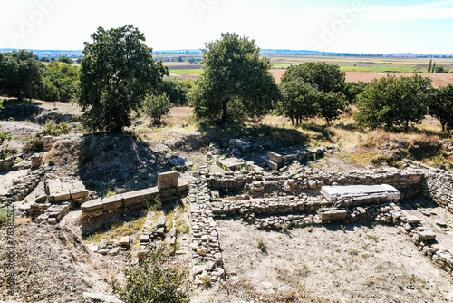 Excavated stone foundations at Troy archaeological site, daylight, historical and educational content. Tevfikiye, Canakkale, Turkiye (Turkey) photo