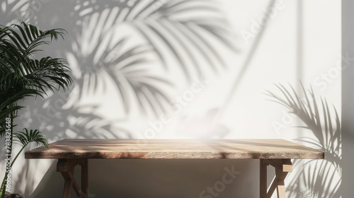 Wooden table and white empty wall with plant shadows. Table shadow background © Mars0hod