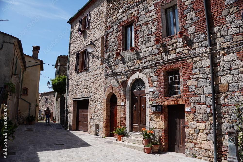 Obraz premium Chiusdino, Siena, Tuscany, Italy - Typical tuscan historical town with narrow street and terracotta bricks.