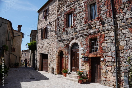 Chiusdino, Siena, Tuscany, Italy - Typical tuscan historical town with narrow street and terracotta bricks.