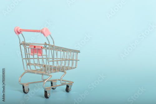 supermarket trolley stands as a symbol of consumer autonomy and choice, ready to be filled with products