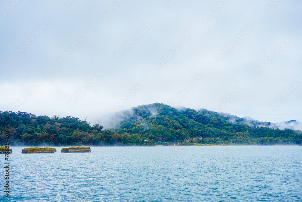 Sun Moon Lake，Nantou, Taiwan, Republic of China, 01 22 2024: The landscape of Sun Moon Lake in a cloudy and foggy day