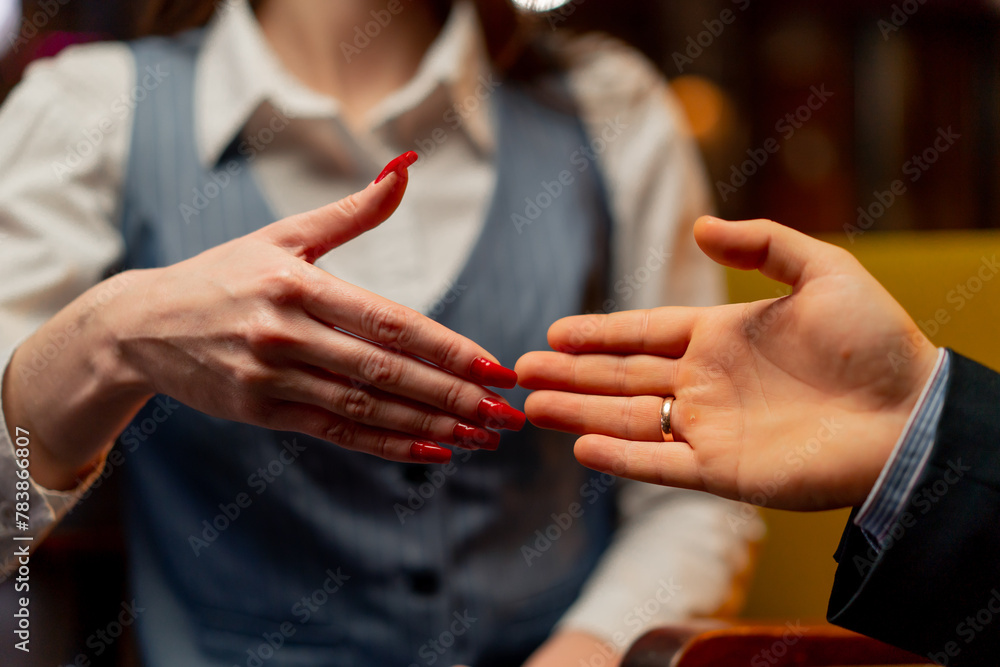 close-up of hands sitting in yellow office chairs businessman made deal with female director shaking hands