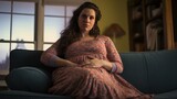  Pregnant woman on couch at home 