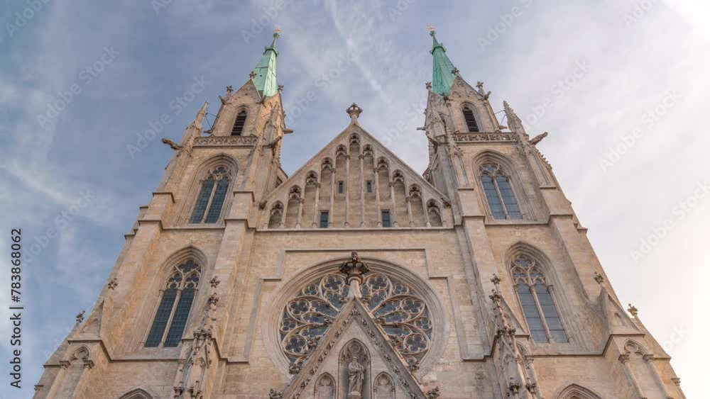St. Paul's Church or Paulskirche timelapse. Looking up perspective. A large Catholic church in the Ludwigsvorstadt-Isarvorstadt quarter of Munich, Bavaria, Germany. Facade front view