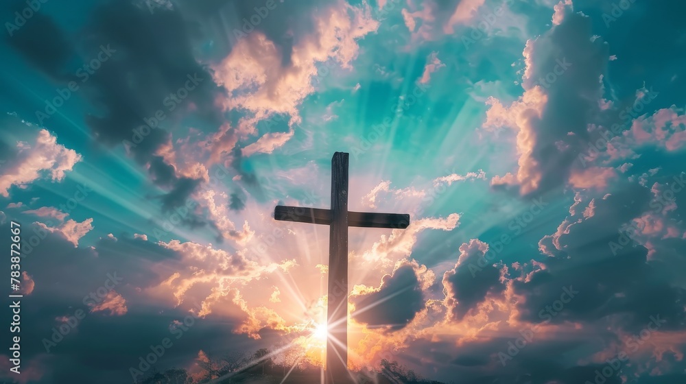 Fototapeta premium Majestic wooden cross silhouetted against a vibrant sky, rays of hope piercing the clouds, a spiritual symbol of faith and redemption.