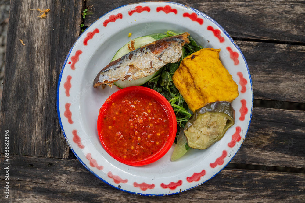 Traditional food of Javanese chicken, tofu, tempe and chili sauce. The ...