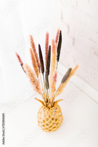 Dry grass bouquet on a white background