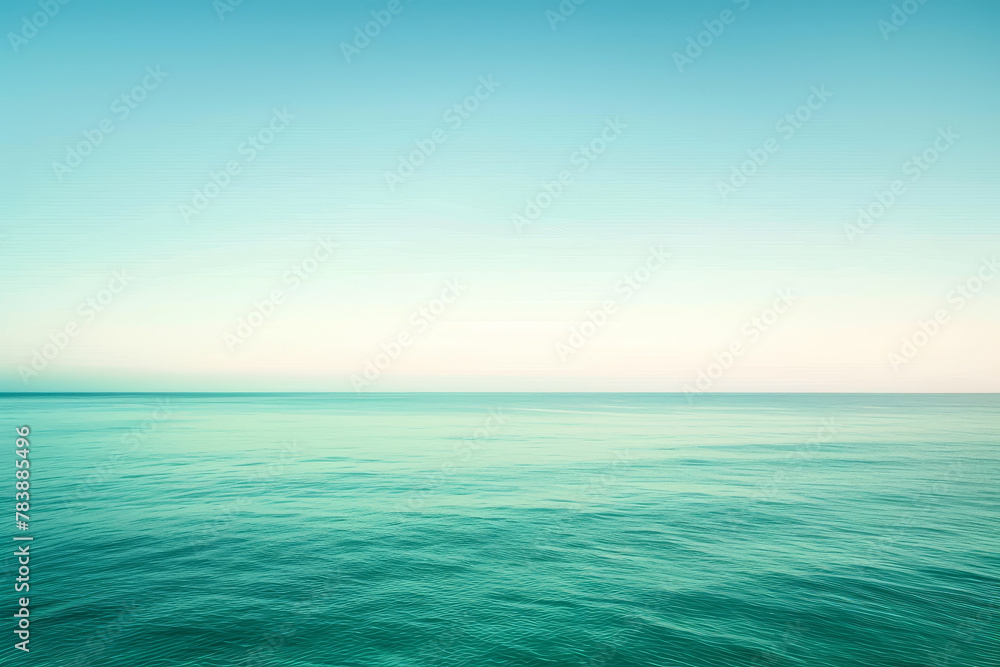 The ocean is calm and blue, with no visible waves The ocean is calm and blue, with no visible waves