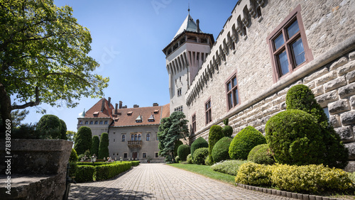 Fairy tale looking beautiful preserved medieval castle with garden in front of it, Slovakia
