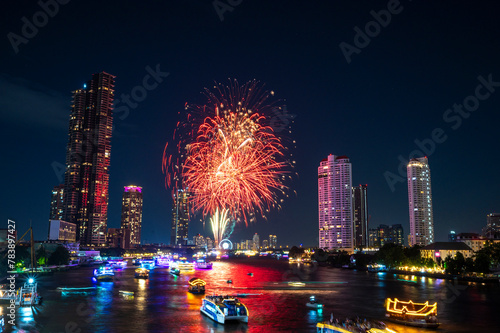Landscape of firework at Taksin Bridge with chaopraya river. downtown Bangkok City Thailand. photo