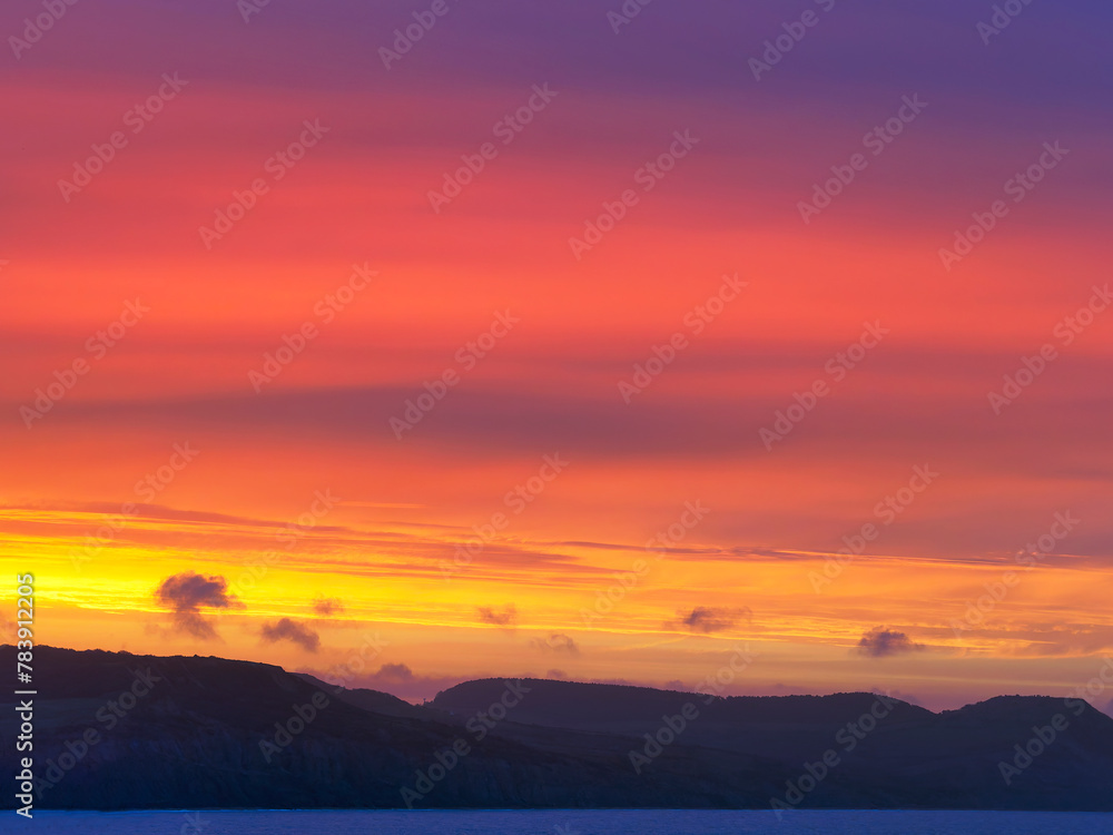 Fiery Dawn Clouds on an April Sunrise over the Jurassic Coast