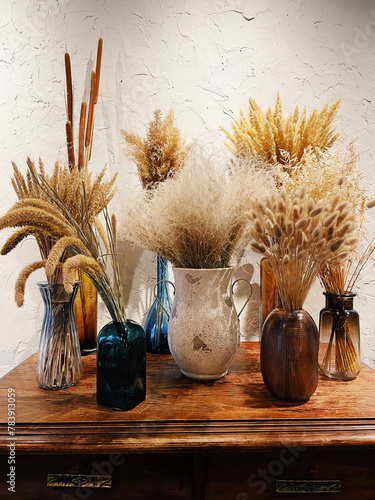 Composition with many different dried flowers in vases © Dasha Petrenko