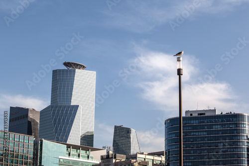 View of the tall buildings with the street lamp
