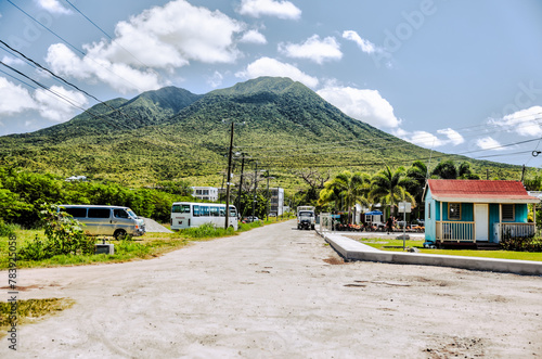 Charlestown, St Kitts and Nevis - March 28, 2028: Beach chairs, palapas and hammocks outside of the port town of Charlestown in Saint Kitts and Nevis
 photo