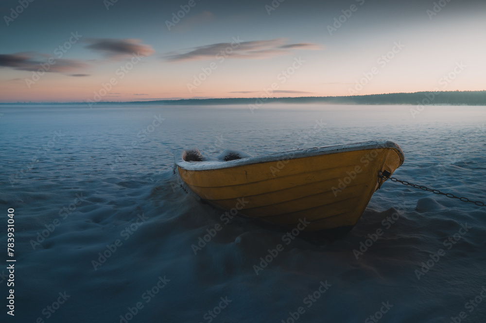 Naklejka premium boat on the frozen sea