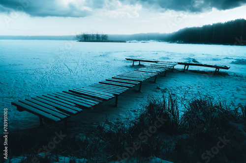 pier on the frozen lake