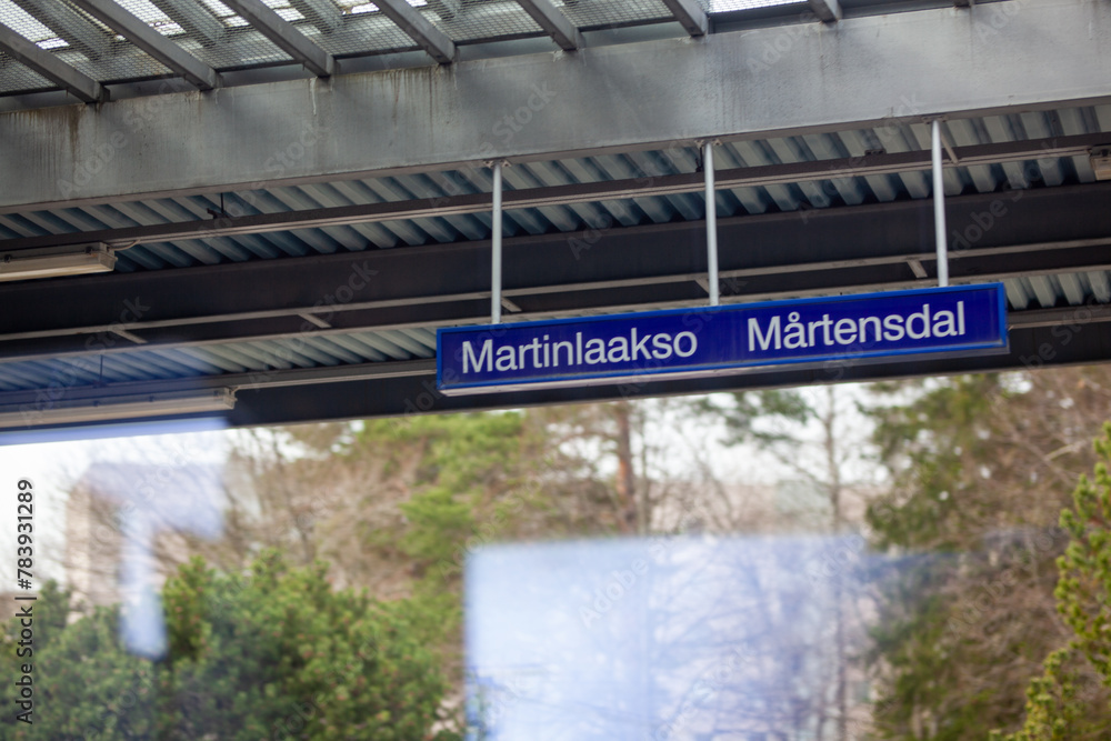 Martinlaakso tarin station sign. Photographed from the train.