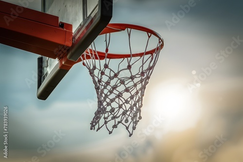 Basketball dunk with net swaying on basketball field, victory moment photo