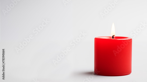 red color burning candle on one side