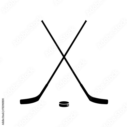 Hockey. Two crossed hockey sticks and puck - vector illustration