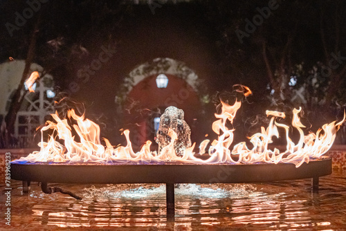 Night photograph of A ring of fire over a fountain of water in the center of a plaza in Mexico City, Mexico CDMX © John McAdorey