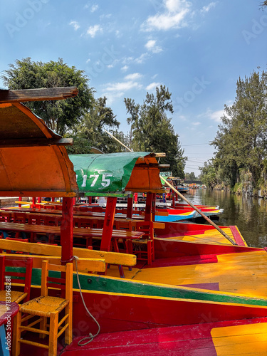 Xochimilco, Mexico City, Mexico - brightly colored boats and the canals of Xochimilco in Mexico City.