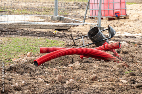 Corrugated pipes for laying cables buried in the ground. © Andrey Nikitin