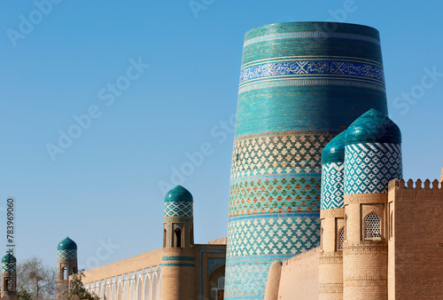 Entrance gate, kalta minaret background, kunya ark citadel, ichon qala, khiva, uzbekistan