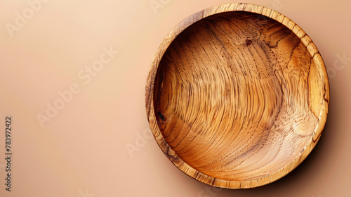 Empty wooden bowl on the background