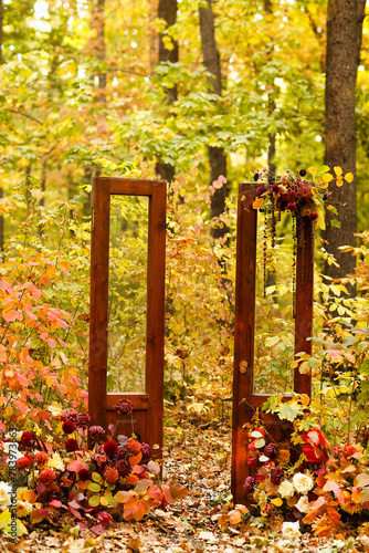 Wooden gate in autumn forest