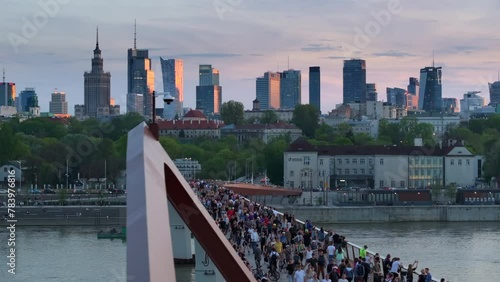 Warszawa, Poland - April 9, 2024: The panoramic view of downtown Warsaw boasts a vibrant mix of monuments and modern skyscrapers, framed by the shape of the newly opened pedestrian and bicycle bridge