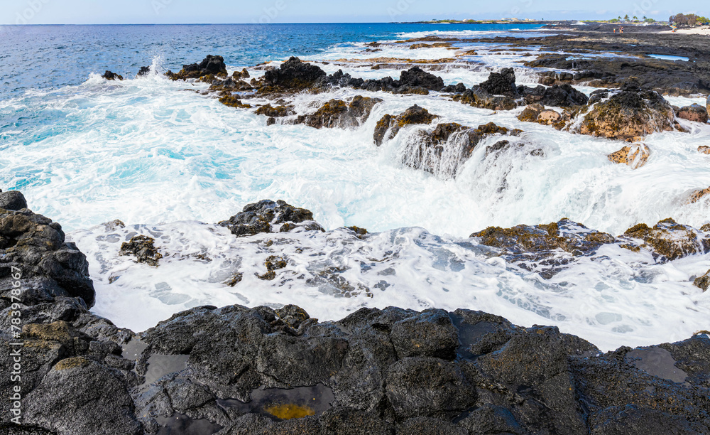 Waves Washing Over The Rocky Volcanic Shoreline at Wawaloli Beach, Wawaloli Beach Park, Hawaii Island, Hawaii, USA