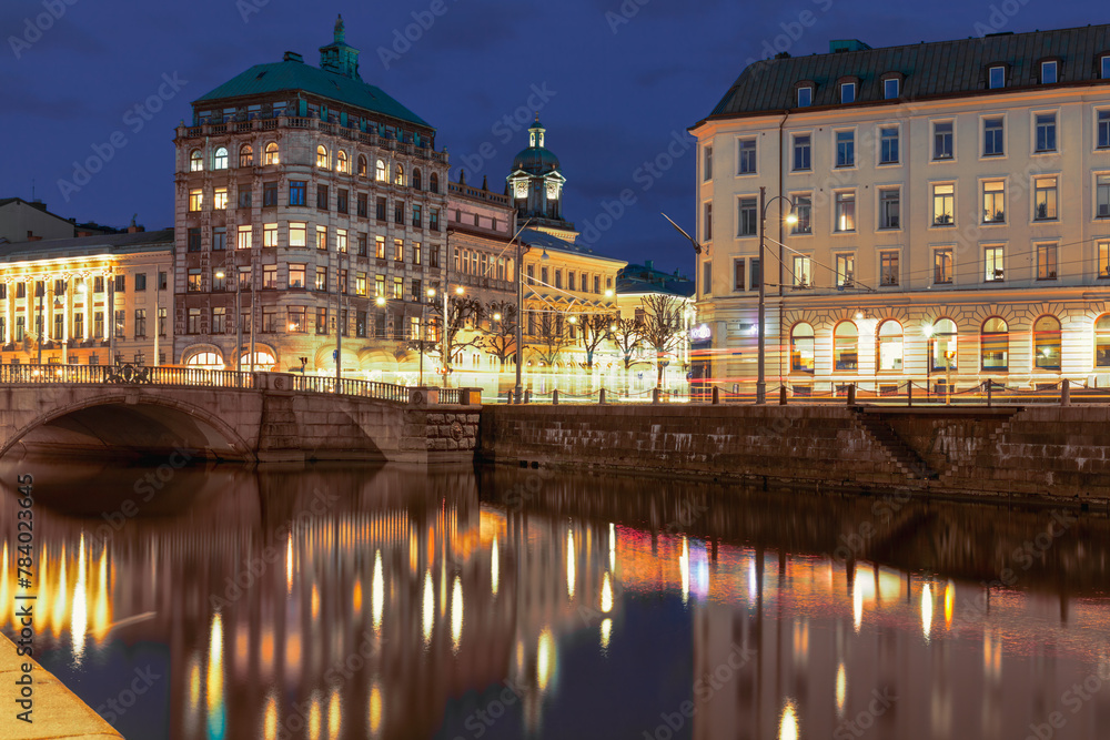 Historic buildings along Gothenburg city canal , night, water reflections. Concept of travel and urban serenity. Gothenburg, Sweden