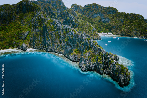 Miniloc Island with limestone cliffs. Aerial drone panoramic picture. Bacuit Archipelago, El Nido, Palawan, Philippines