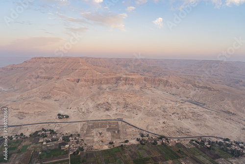 Luxor, Egypt - October 27, 2022. Aereal view of the Mortuary temple of Hatshepsut and the Ramesseum around Luxor during the sunrise.