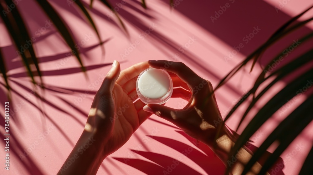 Person holding a bottle of lotion, suitable for beauty and skincare concepts Person holding a bottle of lotion, suitable for beauty and skincare concepts