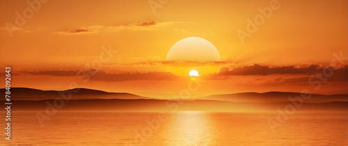 The sun sets perfectly over a distant mountain range, reflecting on a calm sea, creating a feeling of peacefulness photo