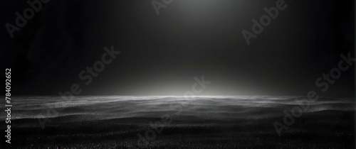 A striking image depicting an expansive dark ocean under a bright moon casting light and creating a moody atmosphere