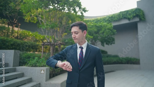 Wallpaper Mural Young adult business man checking time on the wristwatch, work punctuality, smart Businessman get ready to work, self discipline, urban job opportunity, meeting appointment, working deadlines Torontodigital.ca