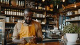 Man in restaurant tablet and inventory check small business