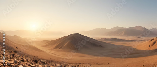 Panorama of beautiful a stone desert at sunrise in haze of soft sunlight  mountain landscape